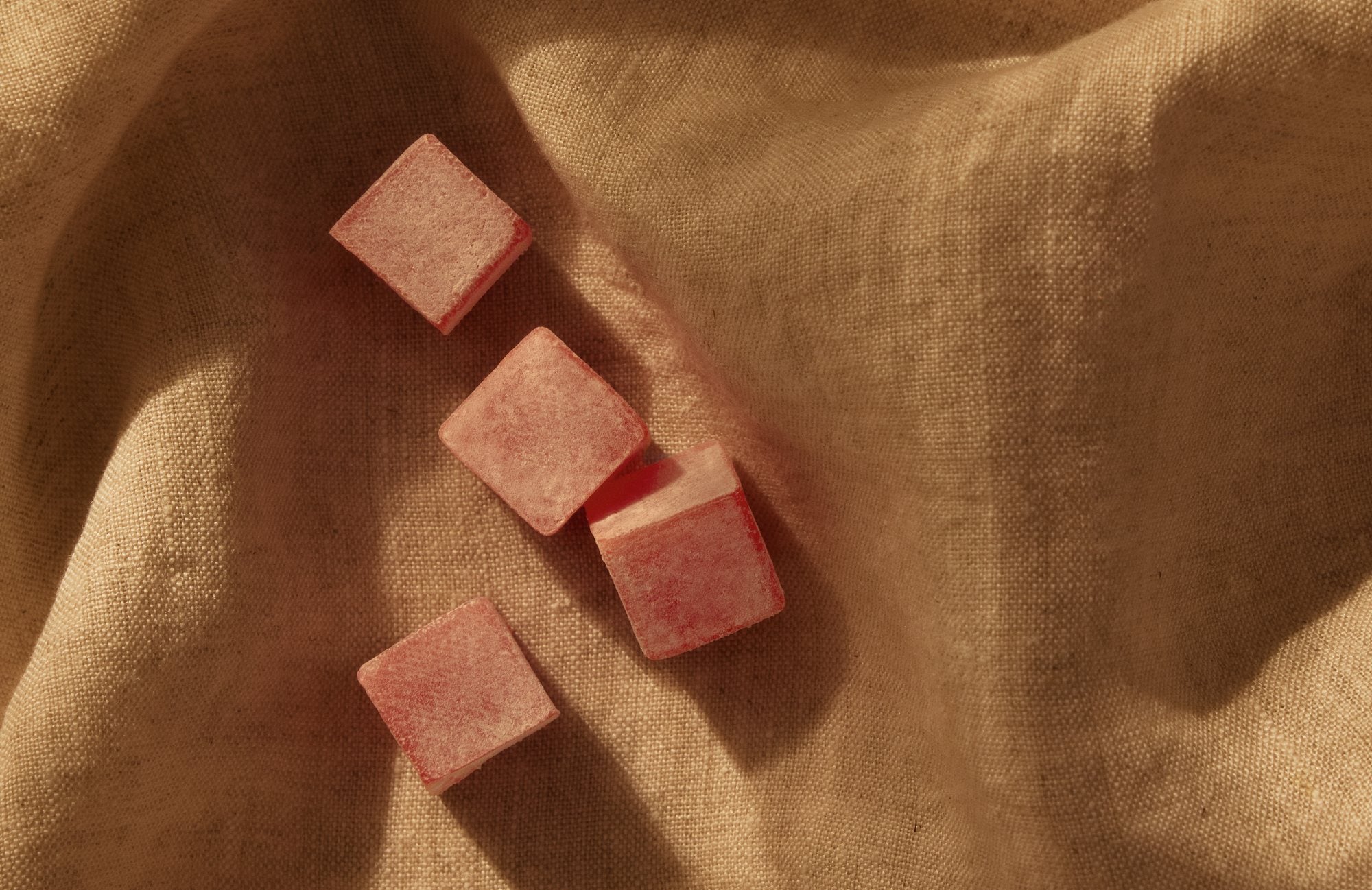 Four Humdrum chews on linen, in low afternoon light